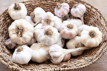 garlic,wooden background ,garlic in a basket
