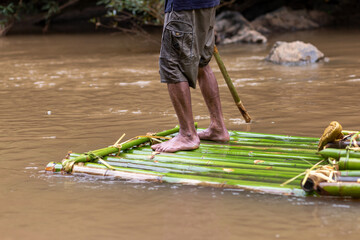 bamboo raft in the river Transportation of rural villagers in the forest, no roads, various uses of...