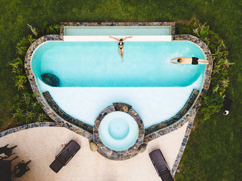 Couple in a swimming pool seen from above