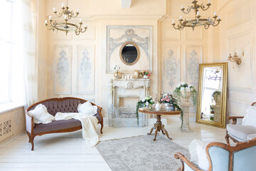 luluxury rich sitting room interior in beige pastel color with antique expensive furniture in...