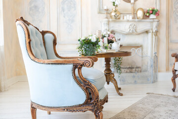 luluxury rich sitting room interior in beige pastel color with antique expensive furniture in...