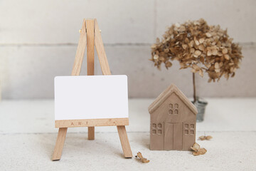 Stylish decor of concrete. Gypsum Craft Ideas. Easel with Mock Up Empty Blank, Concrete or Gypsum...