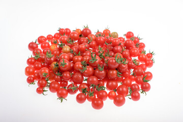 Lot of cherry tomatoes on a white background