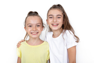 Happy little girls hugging each other