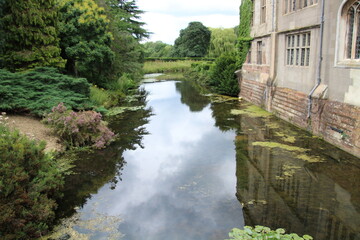 Fototapeta premium old building reflecting into the water 
