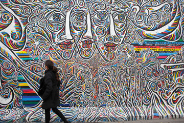 Naklejka premium Graffiti art on Berlin Wall, Berlin, Germany