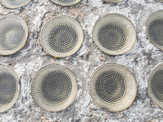 Row of glassy circle bricks in light transmissive ceiling. Safety ceiling