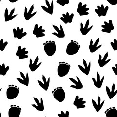 Obraz na płótnie Canvas Seamless repeat pattern with different shape black dinosaur foot prints tracks on a white background. Great for boys and kids designs
