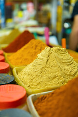 Moroccan spices displayed in a traditional food market.