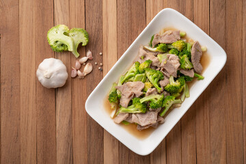 Stir Fried sliced Broccoli with pork shoulder meat in oyster sauce.Thai food.Top view