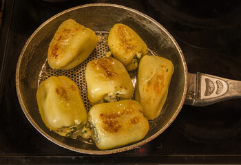 Fried bell peppers with cheese, cottage cheese and herbs. Turkish cuisine.