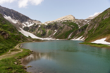 Fototapeta na wymiar Alpine lake called Nassfeld Speicher in Hohe Tauern National Park. Austria
