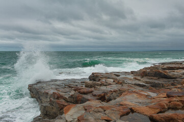 Dramatic scene with Sea waves crashing on rocks
