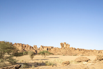 Fototapeta na wymiar Sunrise at sandstone formation in the Sahara desert, Chad, Africa