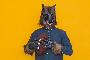 A werewolf with an american football ball