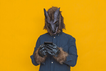 A werewolf using a cell phone