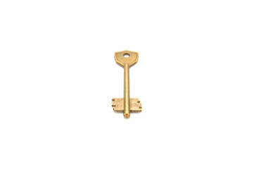 Vintage key on white background close-up. Texture, background, old, macro, wallpaper, metal, brass