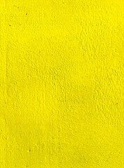 Yellow painted wall background texture.