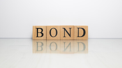The name Bond was created from wooden letter cubes. finance and economy.
