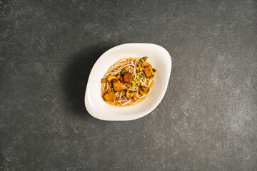 ramen noodles on dark stone surface