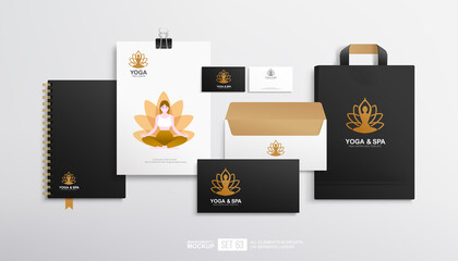 Business stationery branding mockup set with concept of lotos pose yoga and spa logo design. Brand identity set of blank, shopping bag, yoga flyer, business card and envelope. Black stationery - obrazy, fototapety, plakaty