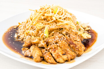 Chinese and Peruvian fusion food: salty chicken with chaufa rice called chijaukay