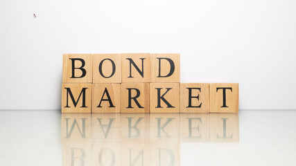 The name Bond market from wooden letter cubes. finance and economy.