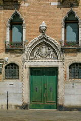 Venetian-style doors along canals, Venice, Italy
