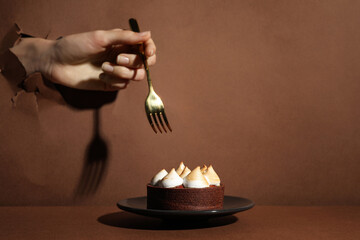 Woman tearing brown paper willing to eat delicious tart, closeup. Space for text