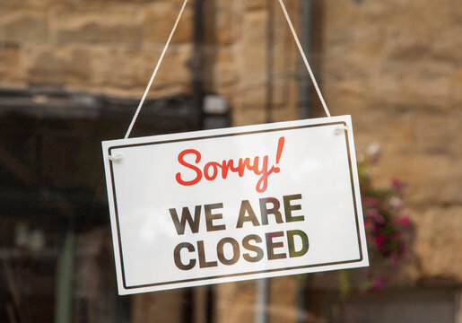 England, UK. 2021.  Sorry, we are closed sign in a shop window.