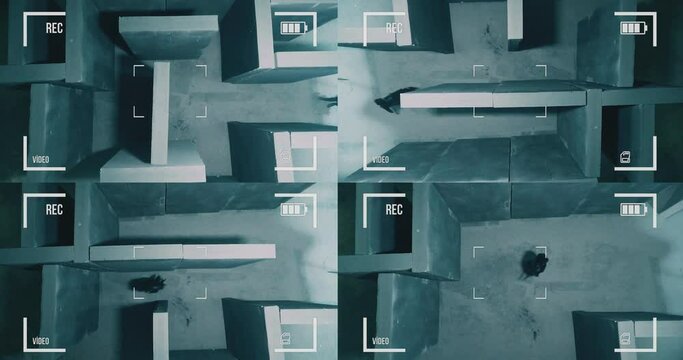 Top view of mystical labyrinth . Man lost in endless maze looking for way out problem solving . Black dressed man walking or running . Footage have special GRAIN , NOISE for security camera effect !