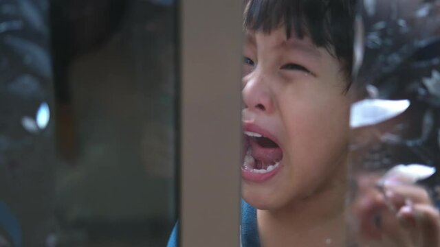 slow motion,Child abuse or child abuse is locked behind a glass door.