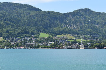 A large body of water with a mountain in the background
