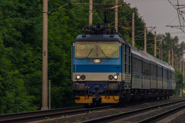 Obraz na płótnie Canvas Trains and whistle stop Olesko in central Bohemia in sunset orange evening