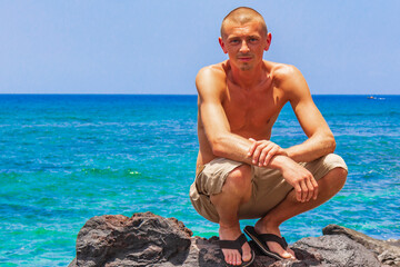 Young male model at Playa del Camisón Tenerife Spain Africa.