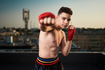 Kickbox fighter training in urban environment