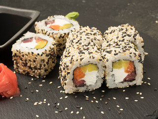 Japanese kitchen. sushi. rolls. inside sesame, salmon, tuna and pickled daikon. close-up photo.