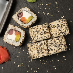 Japanese kitchen. sushi. rolls. inside sesame, salmon, tuna and pickled daikon. close-up photo. Top view.
