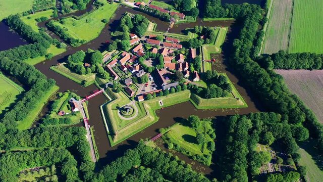 Aerial view from the drone of star-shaped Fort Bourtange, Groningen, The Netherlands. High quality 4k footage