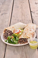 Tortillon whith carne asada stew mexican food background vertical