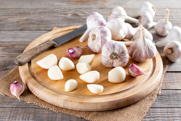 Fresh garlic on a cutting board on table. Frozen garlic. Frozen food Concept