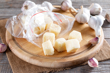 Frozen garlic. Frozen garlic in ice cube on table. Frozen food Concept