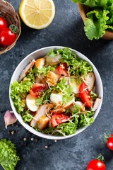 Gordijnen Classic caesar salad with chicken fillet and parmesan cheese. Chicken Caesar Salad. Top view, copy space. © qwartm