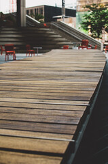 Obraz na płótnie Canvas long curvy wooden bench at Treu North Square in downtown Winnipeg, Manitoba, Canada