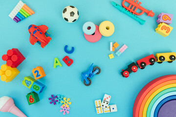 Background with different wooden and plastic kids toys