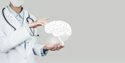 Unrecognizable doctor holding highlighted handrawn Brain in hands. Medical illustration, template, science mockup.
