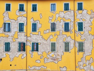Fototapeta na wymiar whimsical exterior facade of a yellow and patchy building