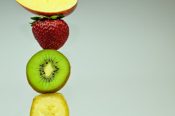 Set of fruits on a light background. Apple, strawberry, kiwi, banana