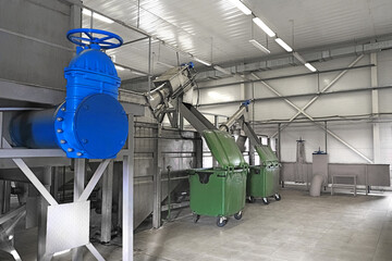 wastewater treatment facility, containers for waste after filter and big blue dead end water pipe...
