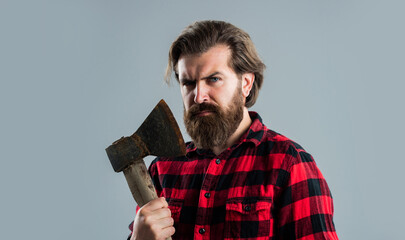 exploring tools. male casual fashion style. handsome hipster with axe. logger or axeman concept